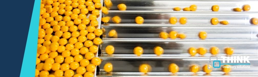 Pharmaceutical Yellow tablets being sorted in a factory