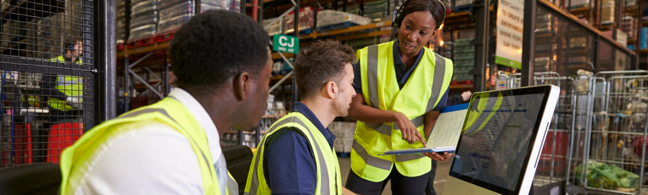 Tablet showing the Think Droid warehouse system, woman in high-vis vest holding a clipboard