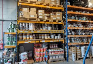 shelves with tins of paint on them