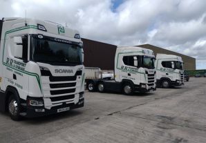 White delivery trucks lined up