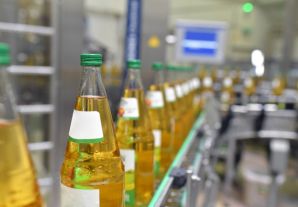 Drink bottles on a factory conveyor belt ready to be packed up